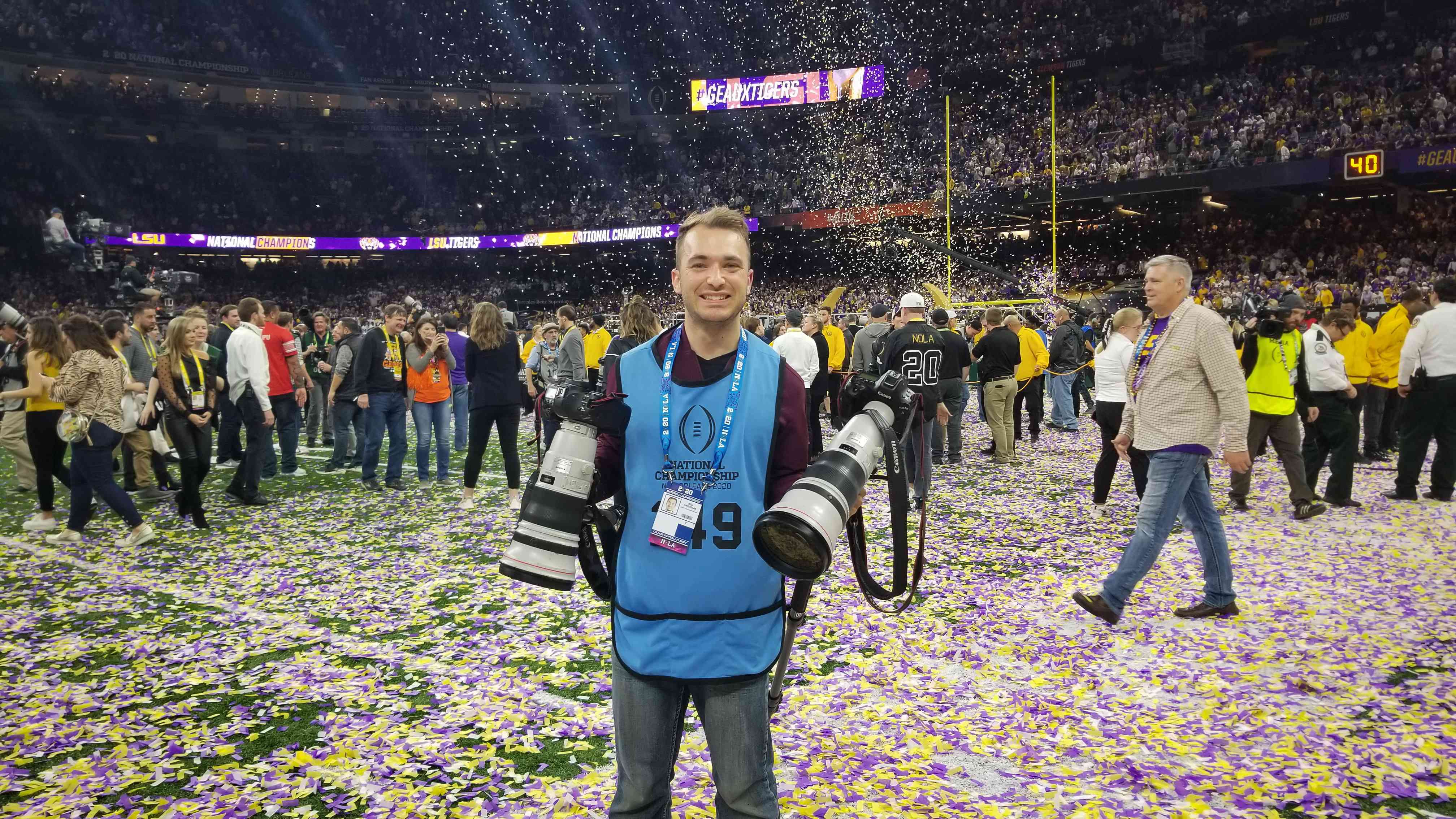 Billy Hardiman posed with cameras after photographing CFP championship game